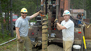 John Greene and Andrew Berg operating the drill rig at the Bemidji site, June 2011.